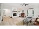 Bright living room featuring a cozy fireplace and modern flooring, perfect for relaxation and entertaining at 7408 Mockingbird Ln, Waxhaw, NC 28173