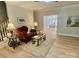 Cozy living room showcases hardwood floors, an elegant sofa set, and a view into the dining area at 7408 Mockingbird Ln, Waxhaw, NC 28173