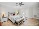 Spacious main bedroom features hardwood floors and plenty of natural light from windows at 7408 Mockingbird Ln, Waxhaw, NC 28173
