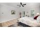 Bright main bedroom features hardwood floors and plenty of natural light from windows at 7408 Mockingbird Ln, Waxhaw, NC 28173