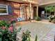 Charming outdoor patio with a swing, comfortable seating, and manicured plants, ideal for relaxation and entertaining at 7408 Mockingbird Ln, Waxhaw, NC 28173