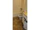 Bathroom with bathtub, toilet with open lid, damaged floor, and damaged cabinet at 7705 Stone Canyon Ln, Charlotte, NC 28227