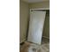 Bedroom with a disassembled door and no flooring at 7705 Stone Canyon Ln, Charlotte, NC 28227