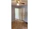 Bedroom with a closet showing repair needed to the flooring at 7705 Stone Canyon Ln, Charlotte, NC 28227