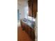 Kitchen boasts a double stainless steel sink, wood cabinets and laminate countertops at 7705 Stone Canyon Ln, Charlotte, NC 28227