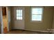 Bright living room featuring a door with glass panes and a window at 7705 Stone Canyon Ln, Charlotte, NC 28227