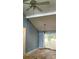 The living room area has high, angled ceilings and sliding glass doors at 7705 Stone Canyon Ln, Charlotte, NC 28227