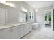 Bathroom with double vanity, soaking tub, and large mirror at 822 River Oaks Ln, Charlotte, NC 28226
