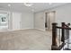 Upstairs bonus room showing staircase and doorway to bathroom with marble floors at 822 River Oaks Ln, Charlotte, NC 28226
