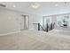 Spacious bonus room with carpet and natural light, perfect for a variety of activities at 822 River Oaks Ln, Charlotte, NC 28226