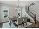 Dining area with a chandelier and staircase at 822 River Oaks Ln, Charlotte, NC 28226