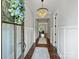 Bright foyer with hardwood floors, chandelier, and view into the living spaces at 822 River Oaks Ln, Charlotte, NC 28226