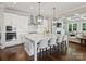Bright, modern kitchen with stainless steel appliances, white cabinets, and a large center island at 822 River Oaks Ln, Charlotte, NC 28226