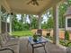 Back patio with view of the backyard, ceiling fan and outdoor seating at 822 River Oaks Ln, Charlotte, NC 28226