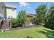 Spacious backyard features a hot tub, patio, and lush lawn at 8427 Penton Pl, Harrisburg, NC 28075
