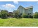 Spacious backyard features a patio with a fire place and grill at 8427 Penton Pl, Harrisburg, NC 28075