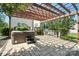 Paver patio features a hot tub, outdoor kitchen and pergola at 8427 Penton Pl, Harrisburg, NC 28075