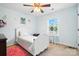Charming bedroom featuring a twin bed, bright window, and vanity with a stool at 8427 Penton Pl, Harrisburg, NC 28075