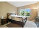 Cozy bedroom featuring a large window offering plenty of natural light at 8427 Penton Pl, Harrisburg, NC 28075