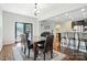 Open concept dining room flows into the kitchen and living area, great for entertaining at 8427 Penton Pl, Harrisburg, NC 28075