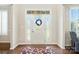 Bright foyer featuring a white front door with glass panels and sidelights at 8427 Penton Pl, Harrisburg, NC 28075