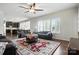 Open-concept living room with shutters and view into the kitchen with a dark island at 8427 Penton Pl, Harrisburg, NC 28075