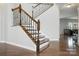 Wooden staircase with iron railing at 8427 Penton Pl, Harrisburg, NC 28075