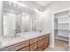 Bathroom featuring double sink vanity, hardwood floors, and glass enclosed shower at 1010 Oneil Dr, Monroe, NC 28112