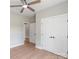 Neutral bedroom with closet and doorway, illuminated with a ceiling fan at 1010 Oneil Dr, Monroe, NC 28112