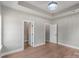 Neutral bedroom featuring hardwood floors and two entry doors at 1010 Oneil Dr, Monroe, NC 28112