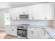 Updated kitchen featuring stainless steel appliances, quartz countertops, and ample storage at 1010 Oneil Dr, Monroe, NC 28112