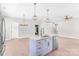 Modern kitchen features a view of the center island with modern pendants and stainless appliances at 1010 Oneil Dr, Monroe, NC 28112