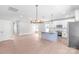 Bright, open kitchen with a large island, stainless steel appliances, and hardwood floors at 1010 Oneil Dr, Monroe, NC 28112