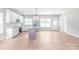 Bright, open kitchen with a large island, stainless steel appliances, and hardwood floors at 1010 Oneil Dr, Monroe, NC 28112