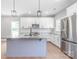 Stylish kitchen features white cabinets, granite countertops, stainless steel appliances, and center island at 1010 Oneil Dr, Monroe, NC 28112