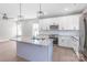 Open kitchen with island seating, pendant lighting, stainless appliances, and white cabinets at 1010 Oneil Dr, Monroe, NC 28112