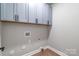 Laundry room with upper cabinets to maximize space and storage at 1010 Oneil Dr, Monroe, NC 28112