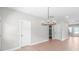 Bright living space featuring wood floors, neutral paint, modern lighting, and open design at 1010 Oneil Dr, Monroe, NC 28112