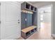 Welcoming mudroom with built-in storage, bench, and convenient hooks at 1010 Oneil Dr, Monroe, NC 28112