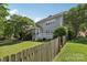A fenced-in backyard features a well-maintained lawn and provides privacy for outdoor enjoyment at 10121 Edgecliff Rd, Huntersville, NC 28078