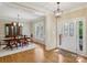 Formal dining room showcasing hardwood floors and a large window at 10121 Edgecliff Rd, Huntersville, NC 28078