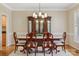 Dining room with hardwood floors, furniture, and chandelier at 10121 Edgecliff Rd, Huntersville, NC 28078