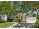 View of the home's exterior showcasing the garage and landscaped yard at 10121 Edgecliff Rd, Huntersville, NC 28078