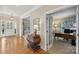 Inviting foyer featuring hardwood floors and an elegant chest at 10121 Edgecliff Rd, Huntersville, NC 28078