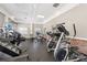 Modern gym with treadmills, elliptical machines, and weight stations for fitness enthusiasts at 10121 Edgecliff Rd, Huntersville, NC 28078