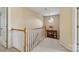 Upstairs hallway with natural lighting and view of decorative table at 10121 Edgecliff Rd, Huntersville, NC 28078
