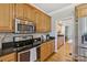 Kitchen with stainless steel appliances, granite countertops, and ample cabinet space at 10121 Edgecliff Rd, Huntersville, NC 28078