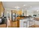 Open kitchen with stainless steel appliances, granite countertops, and breakfast bar seating at 10121 Edgecliff Rd, Huntersville, NC 28078