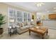Bright living room with plantation shutters, neutral colors, and open floor plan at 10121 Edgecliff Rd, Huntersville, NC 28078