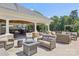 Outdoor lounge area with comfortable seating, a bar, TVs and a great space to entertain at 10121 Edgecliff Rd, Huntersville, NC 28078